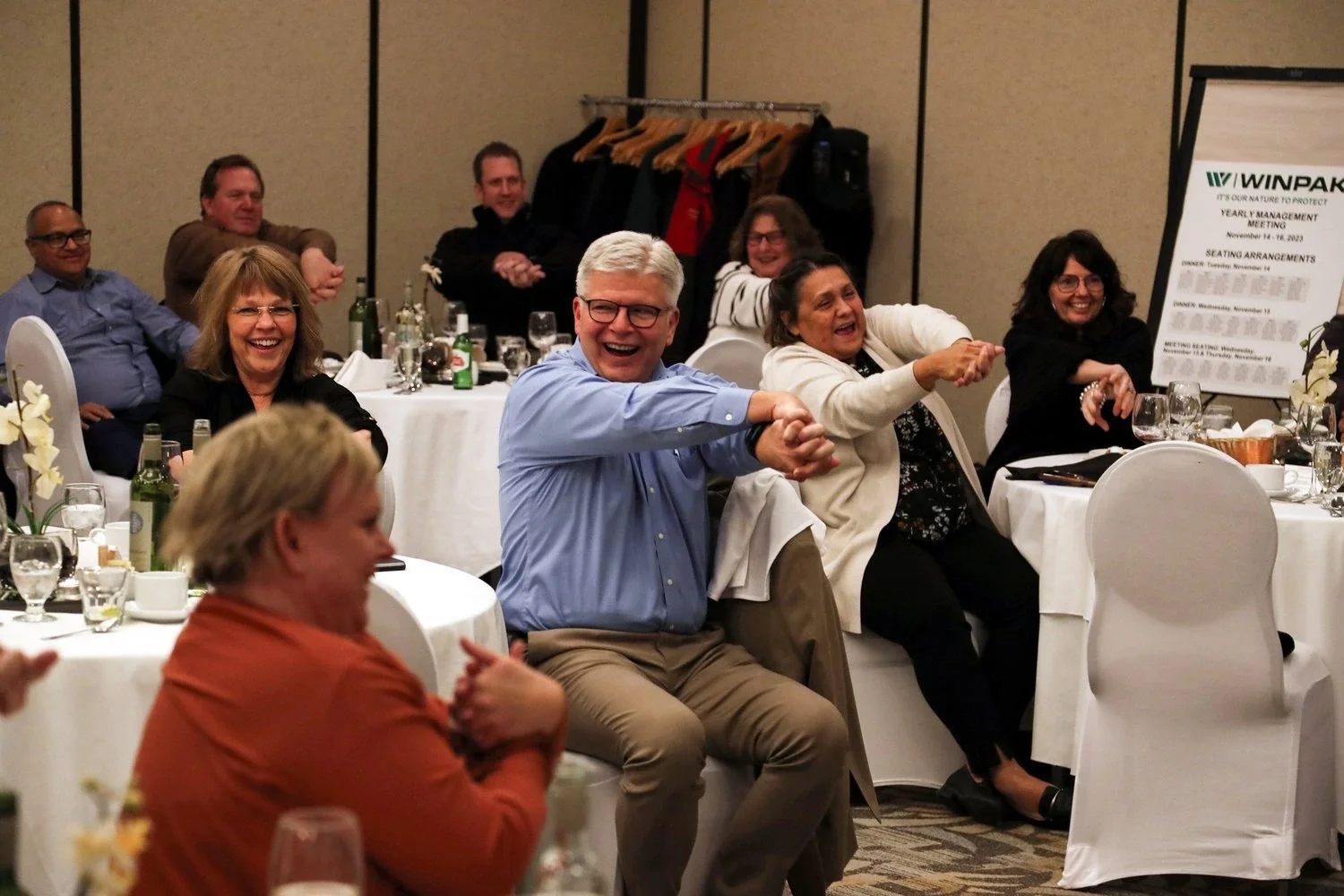 audience laughing during interactive magic trick