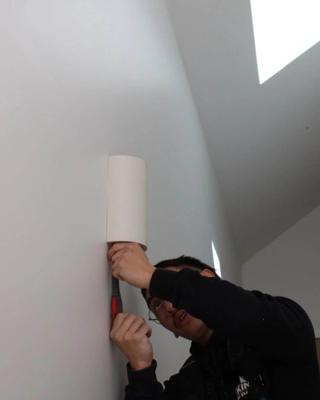 Taking every precaution to make sure feature lighting is perfectly aligned. Precision in planing and installation means the final result not only looks striking, but also functions exactly as intended. It's the details like these that bring a project