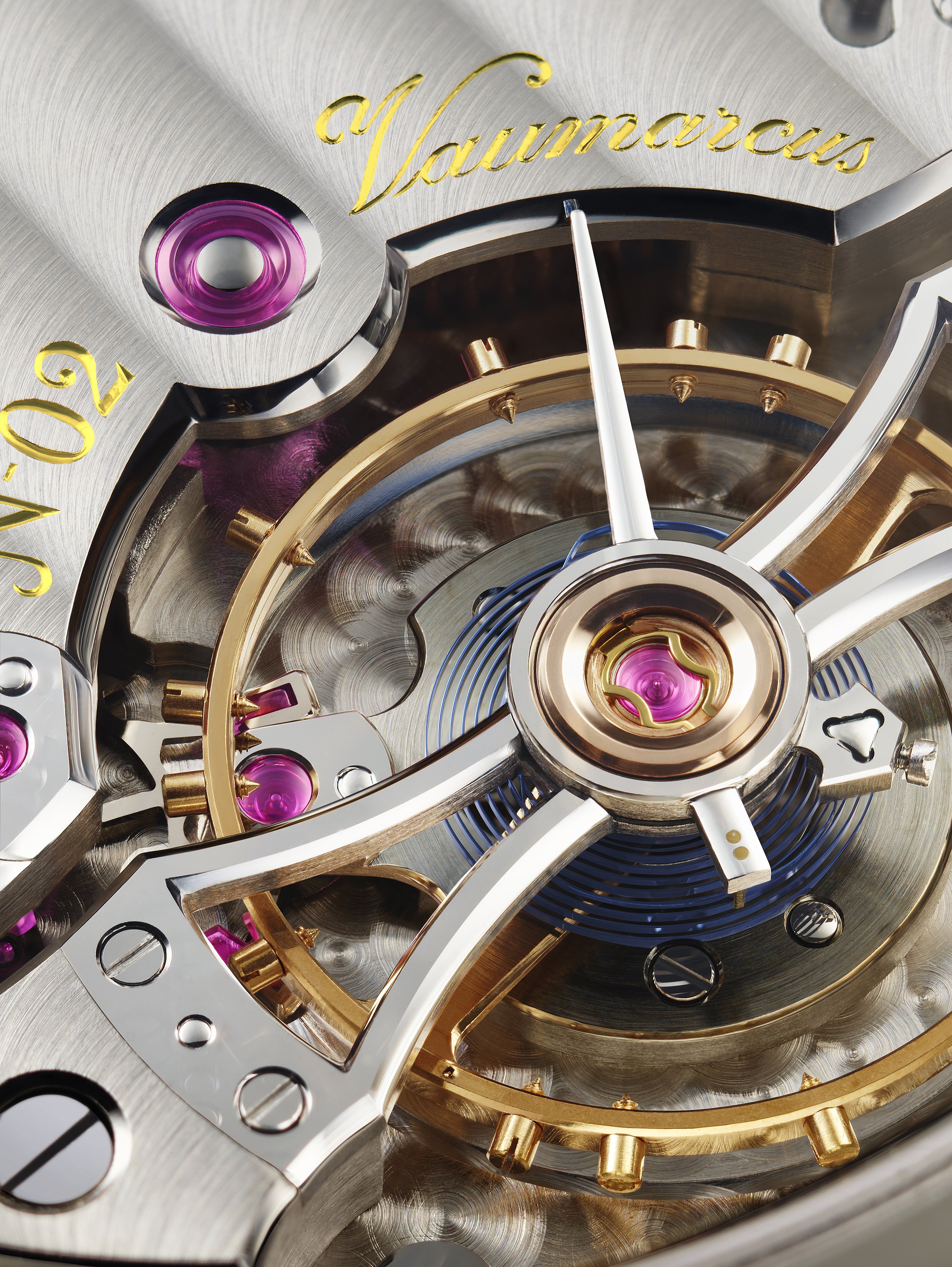 Close-up of the intricate inner mechanism of a luxury watch, featuring gears, screws, and the word "Voumara" in gold script.