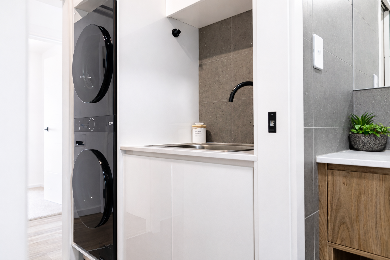 Compact laundry and kitchenette setup.png