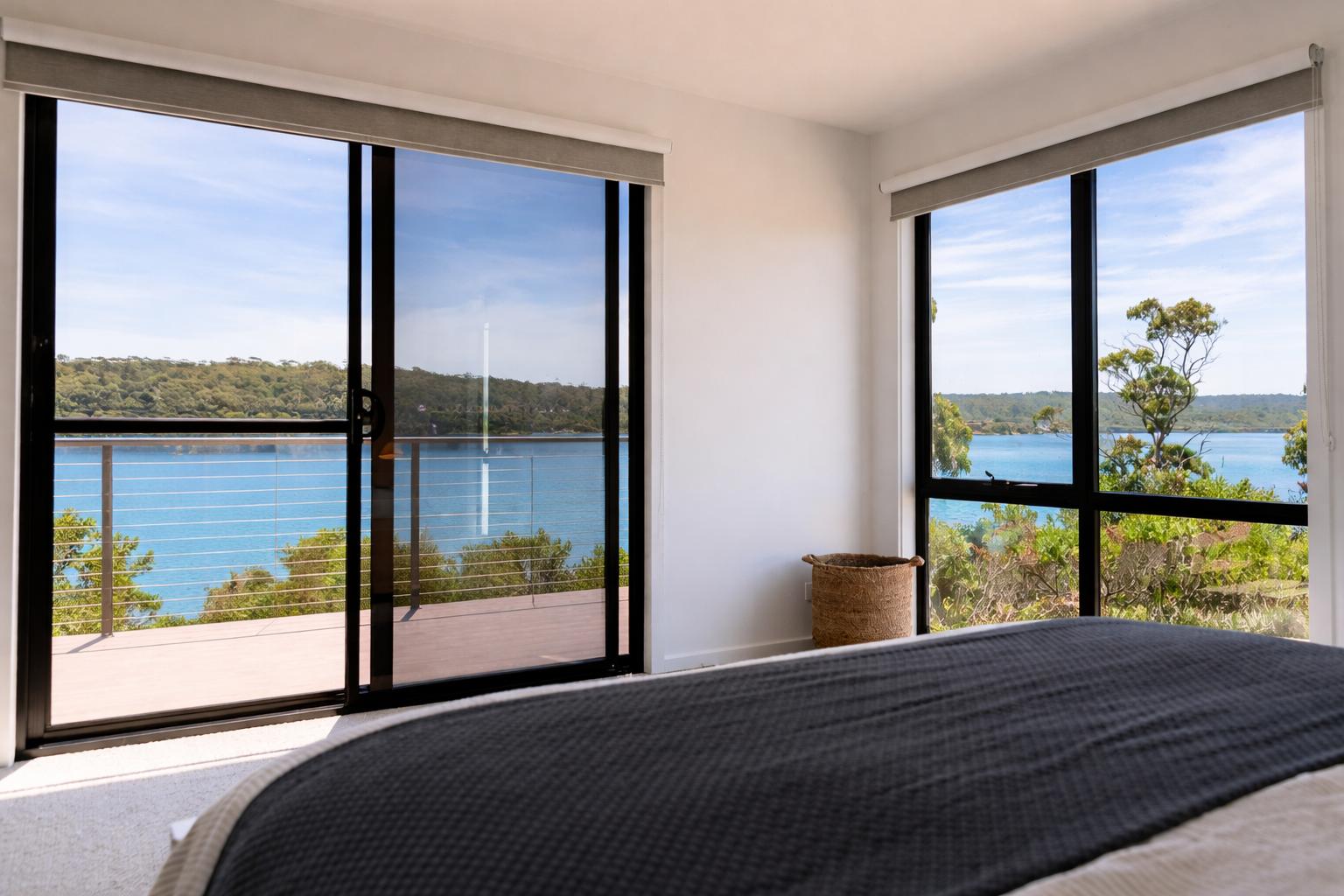 Contemporary bedroom with waterfront view.png