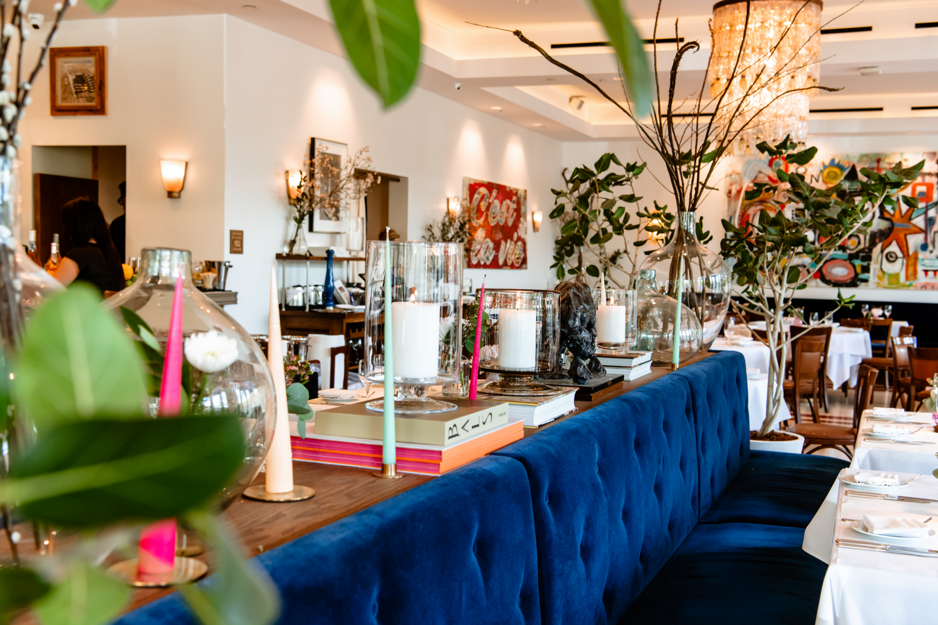 Le Bilboquet Denver dining room with curated art and fresh florals