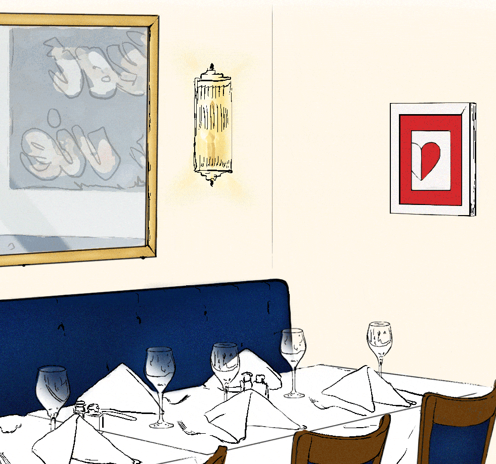 A decorated dining table in a restaurant with four wine glasses, napkins, and condiment bottles. The wall has a framed abstract art piece with a gold frame, a wall sconce, and a heart-themed picture.