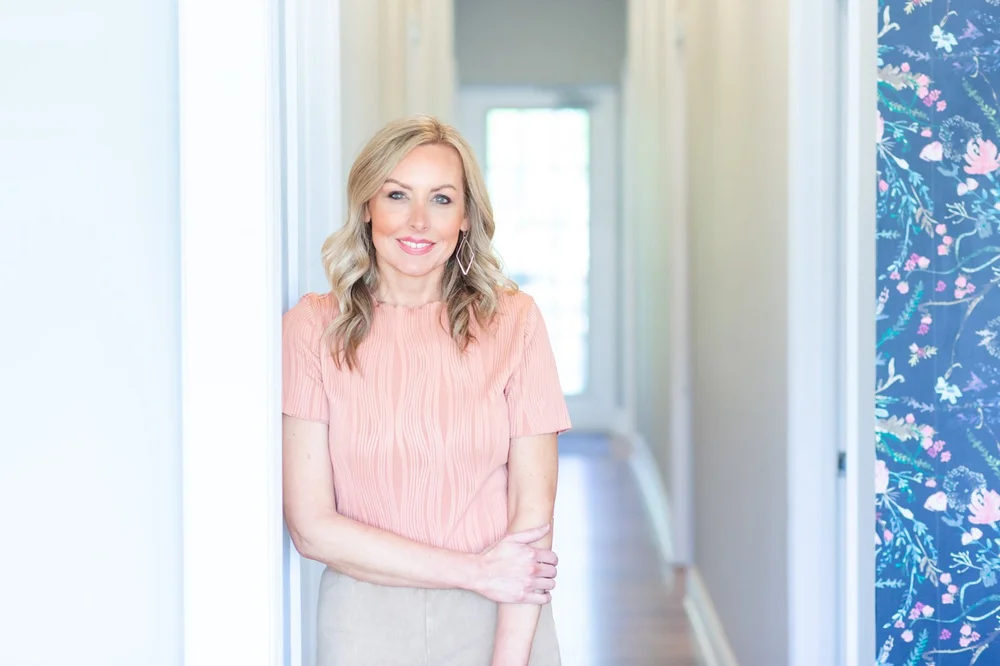 Hanna Stiltner, founder of Soul Story Therapy, in a hallway at one of our offices