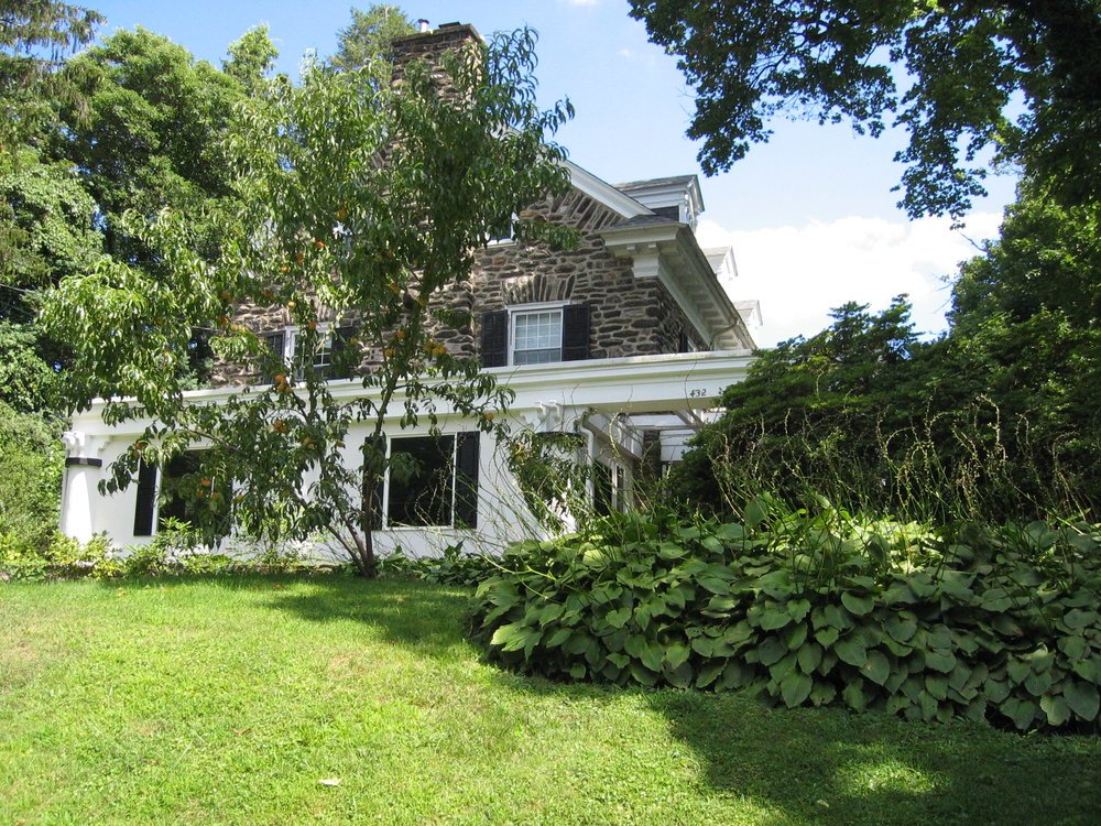 Before - The original glass sunporch was long gone. Replaced but a white stucco box.