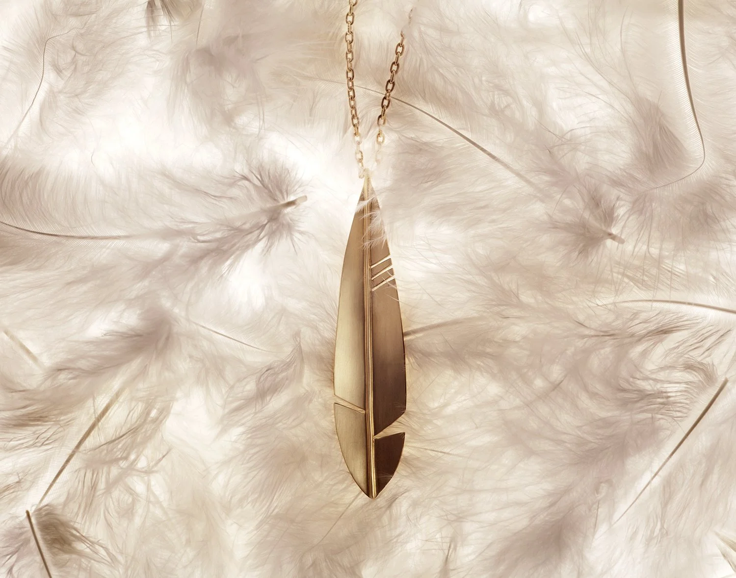 pcook-manonnyc-feather-pendant.jpg