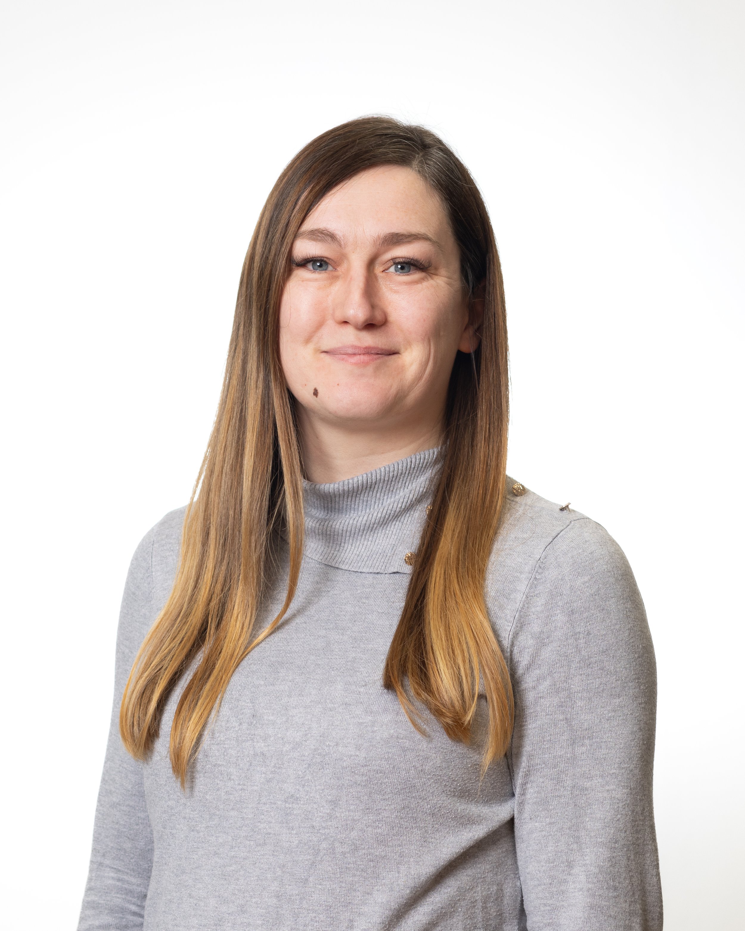 Profile photo of a caucasian woman with long light brown hair