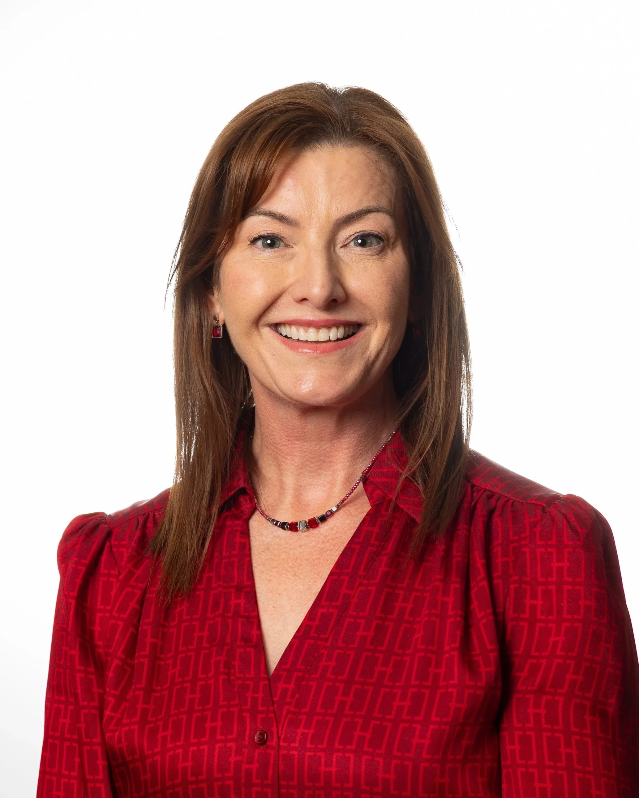 Image of a professional looking woman with long dark hair