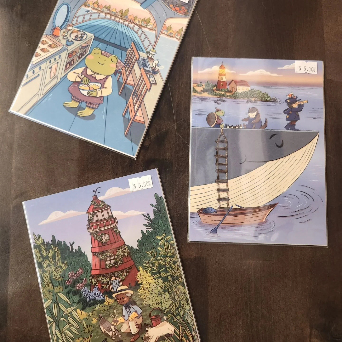 New retail alert! Art prints/postcards by @justine.gilbuena in three adorable and whimsical designs that remind us to slow down and enjoy Duluth summer. $5.00 each + tax.