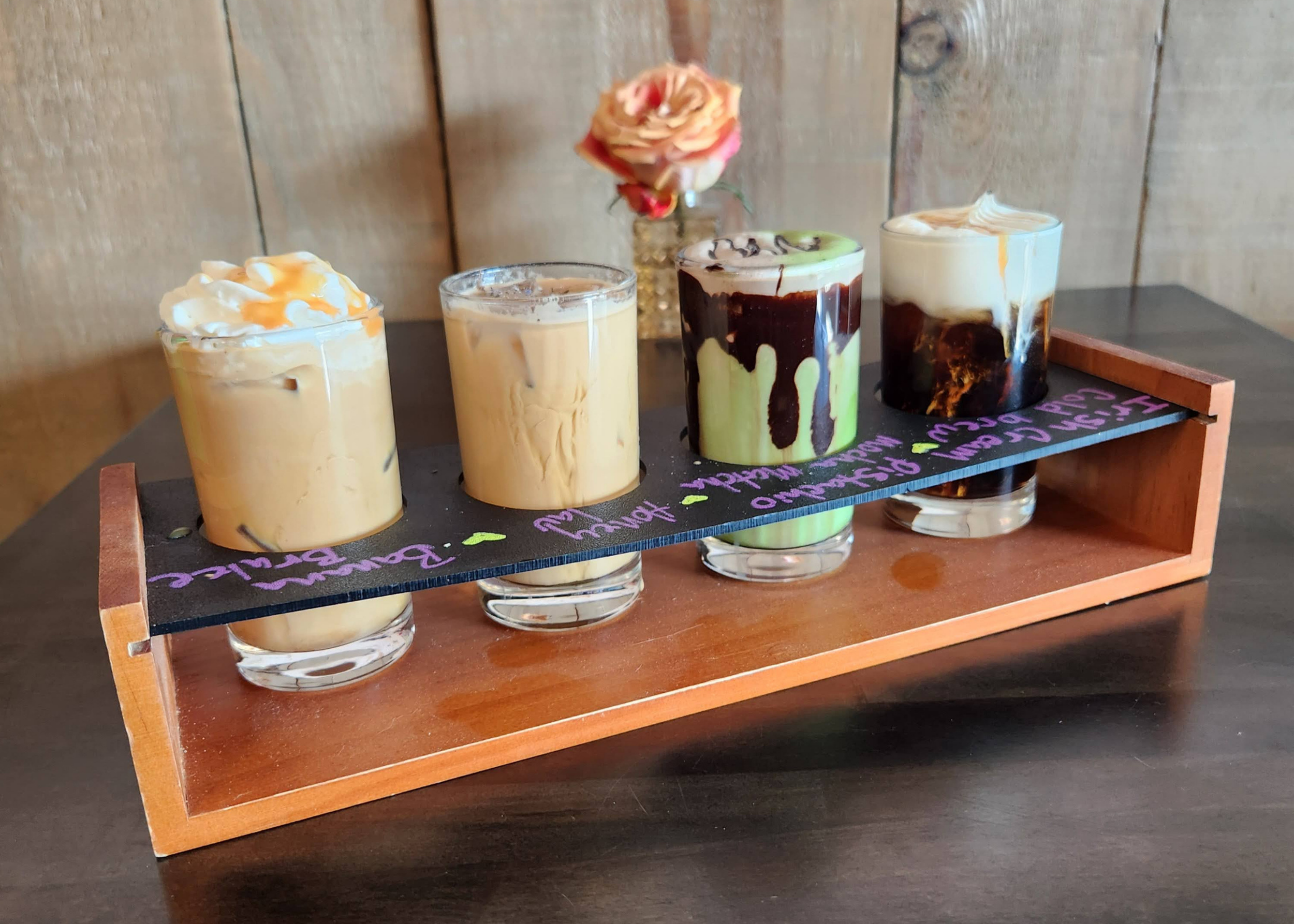 🐾Spring Drink Flight (4x 5oz)🐾     
Enjoy four, 5 oz mini seasonal drinks in one curated tasting with two served hot and two iced. A balanced lineup of floral, nutty, caramelized, and creamy flavors designed for sipping and comparing.