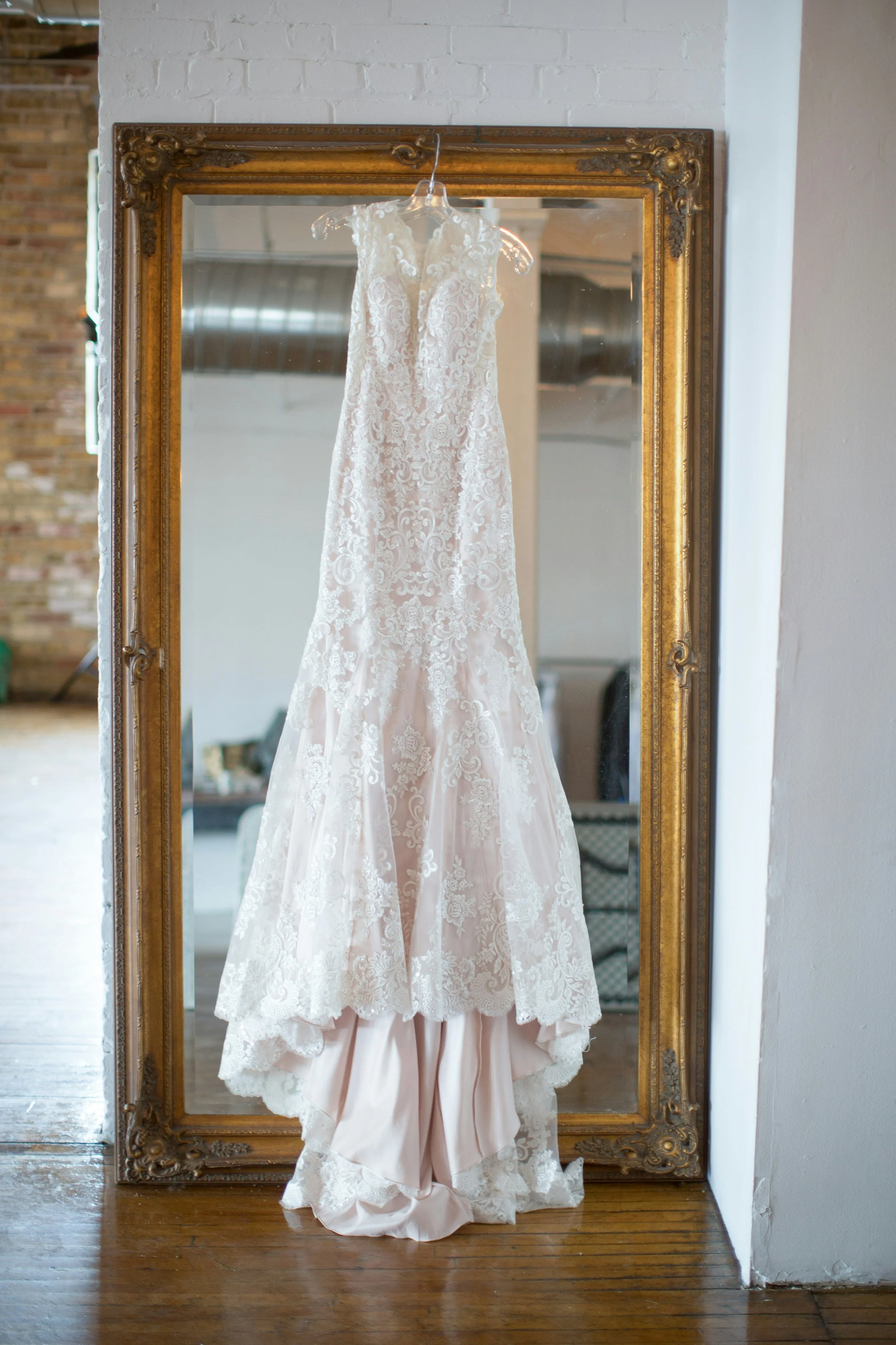 A vintage white lace wedding dress hanging in the historic Blue Note Country Inn near Burnsville, just minutes from Asheville, North Carolina. 