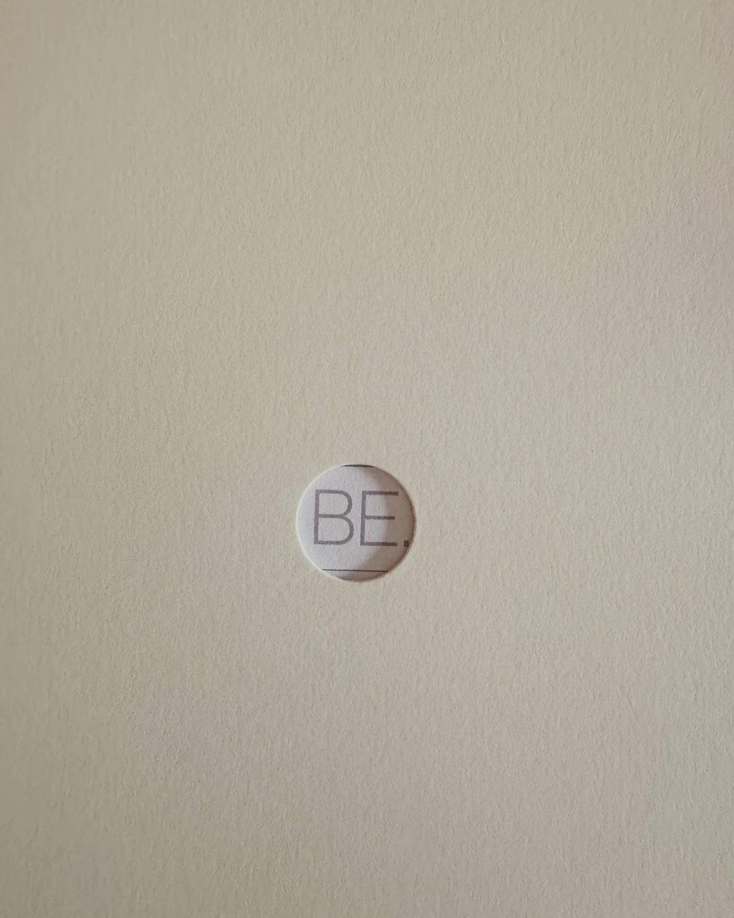 I wasn&rsquo;t trying to find meaning &mdash; it just showed up.

I slipped a postcard into a sleeve and this appeared: BE.

Sometimes, the universe reminds you where you&rsquo;re already headed.