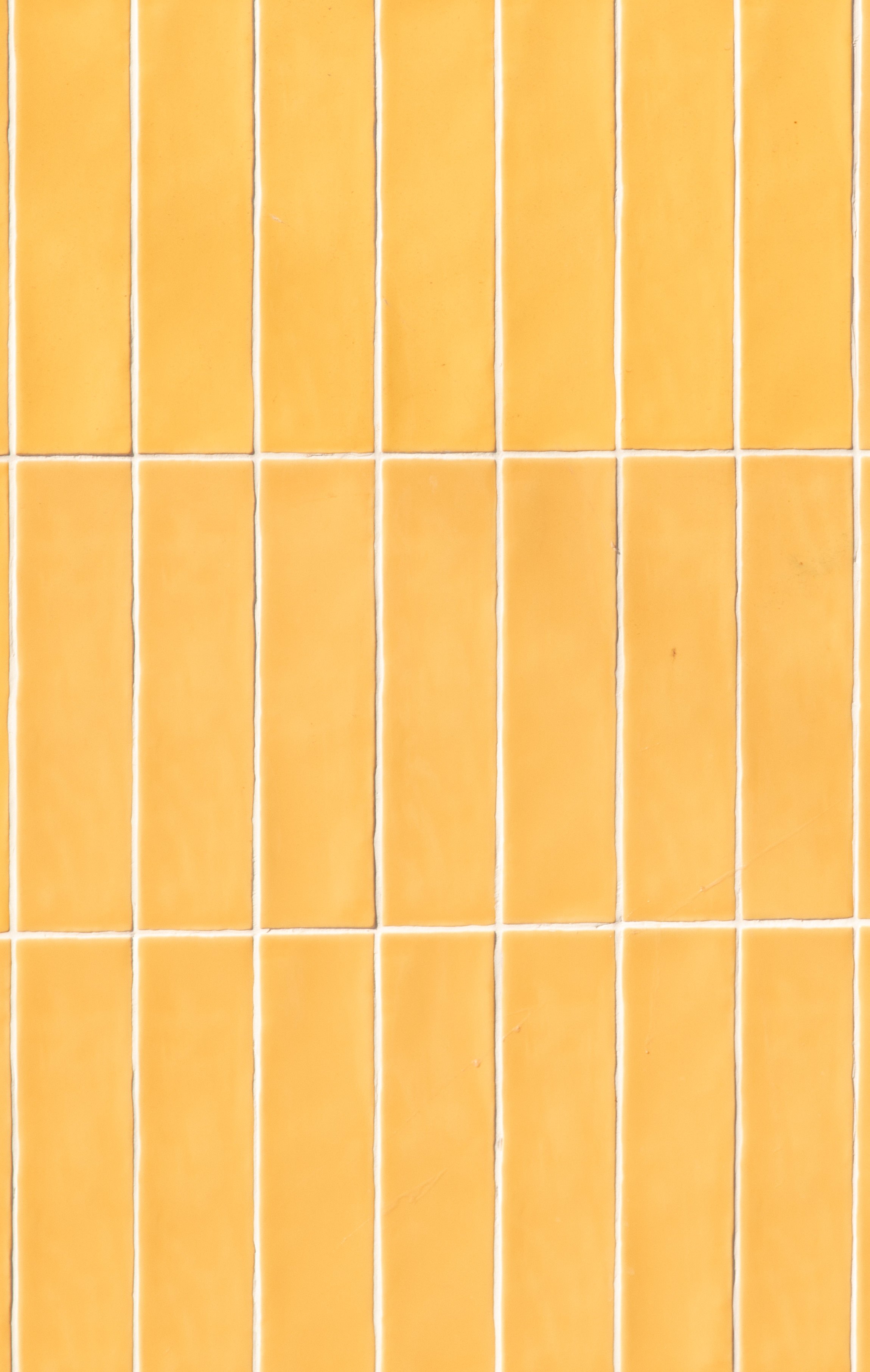 The pattern of our days: yellow tiles lined up like a life, where ambition quietly lives in the spaces between.