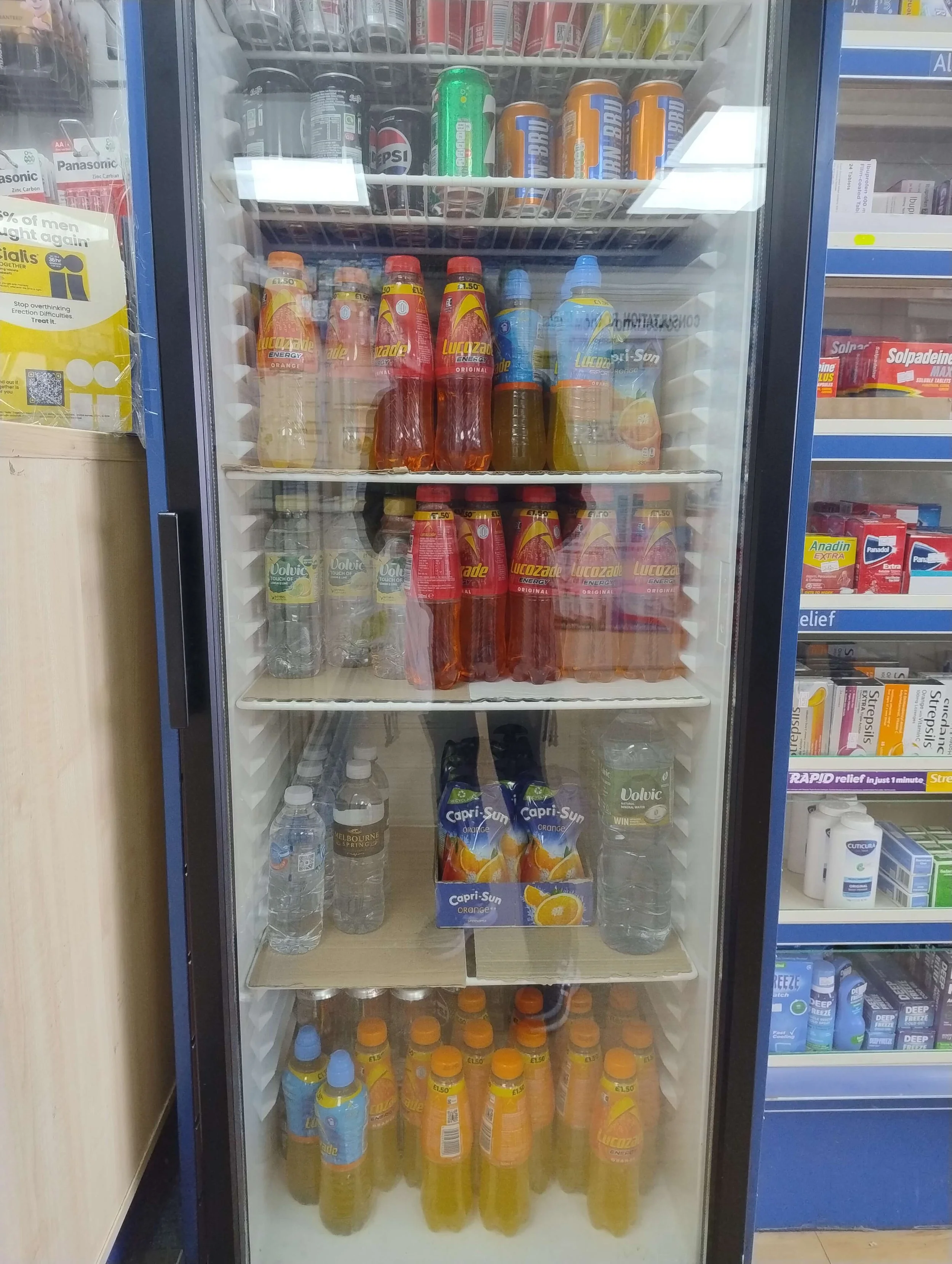 Soft drinks refrigerator at pharmacy checkout counter