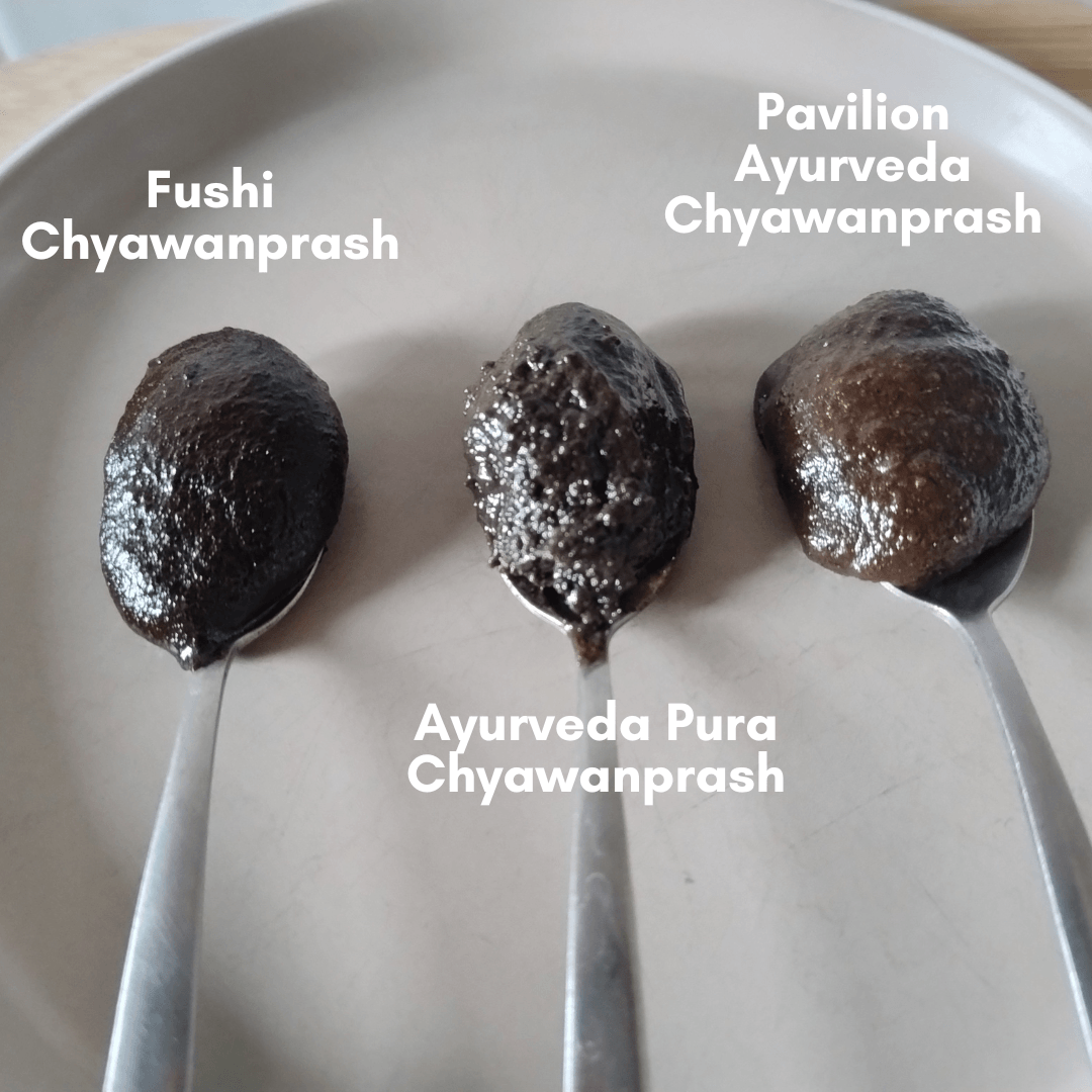 Photo of three teaspoons, each with a spoonful of a different Chyawanprash product on them.