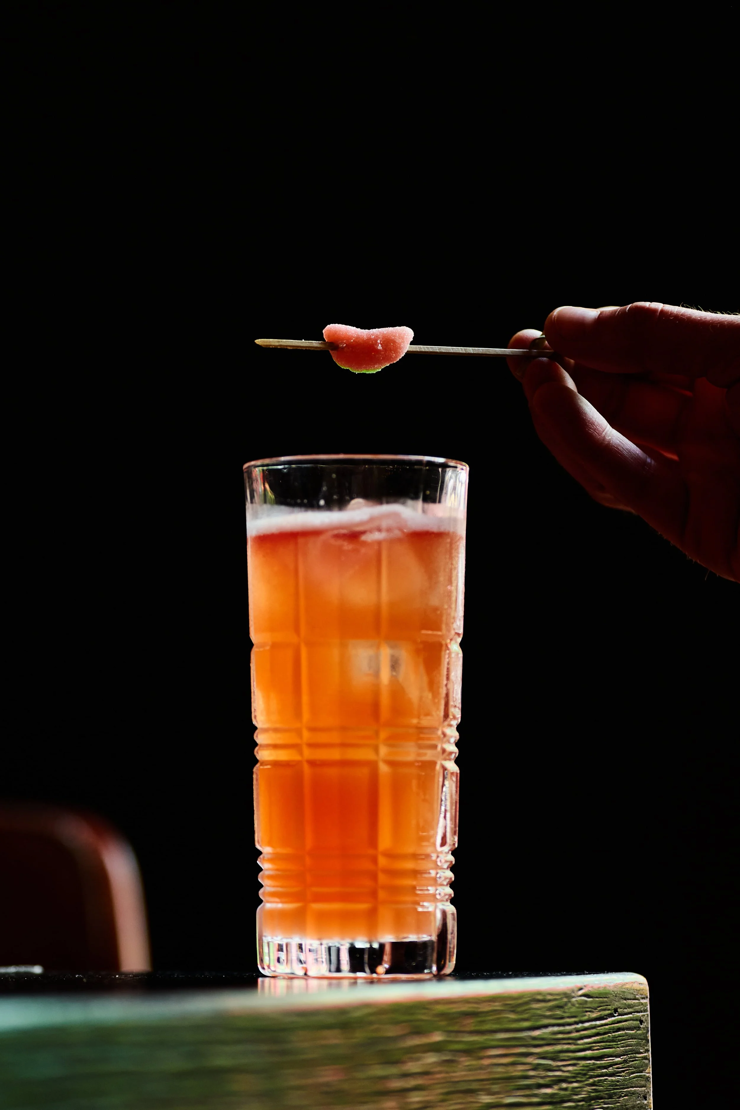 Watermelon Sugar cocktail at BLACKBARN in NoMad, garnished with a watermelon candy on a skewer, near Madison Square Garden