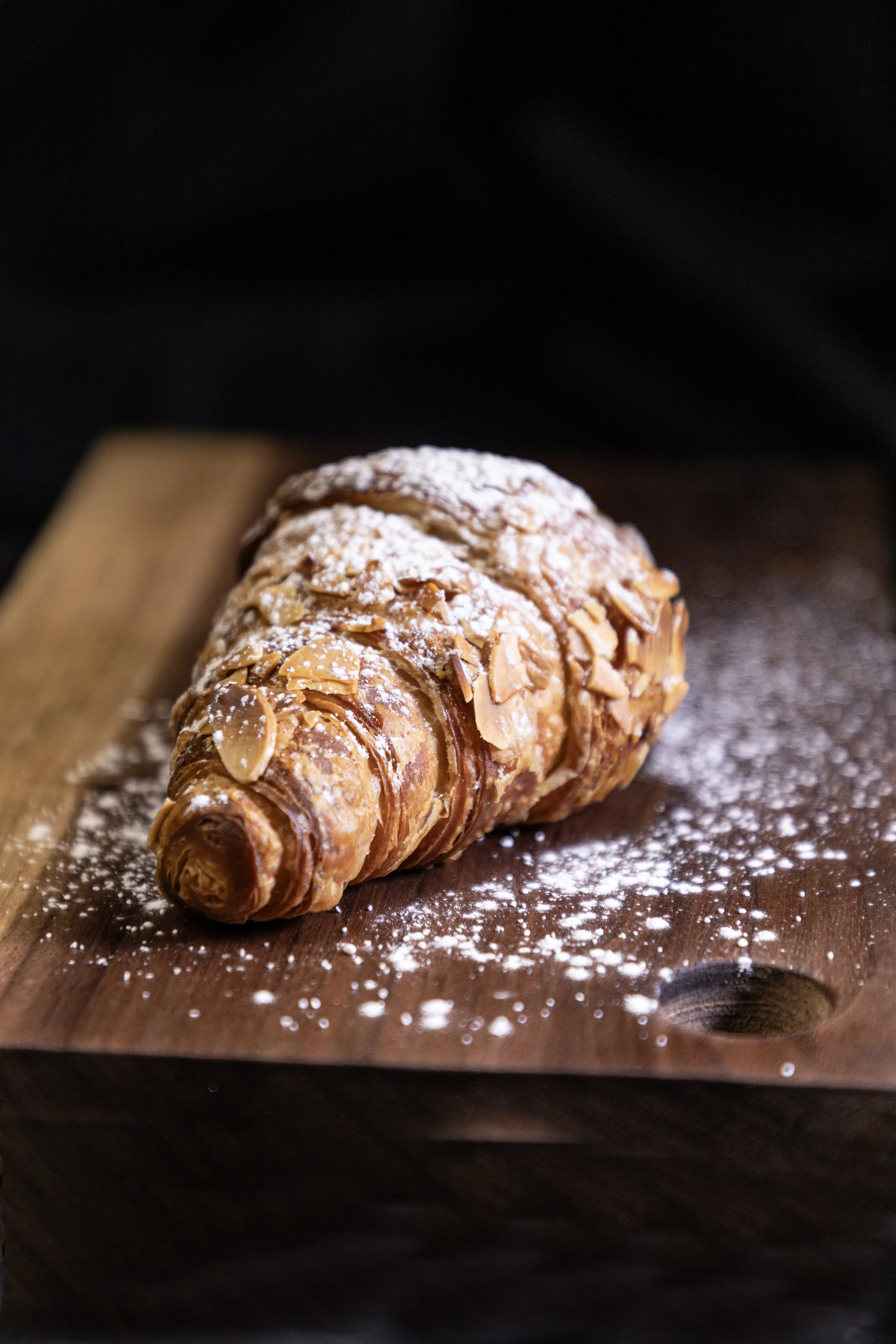 Almond Honey Croissant Pastry dusted with Powdered Sugar