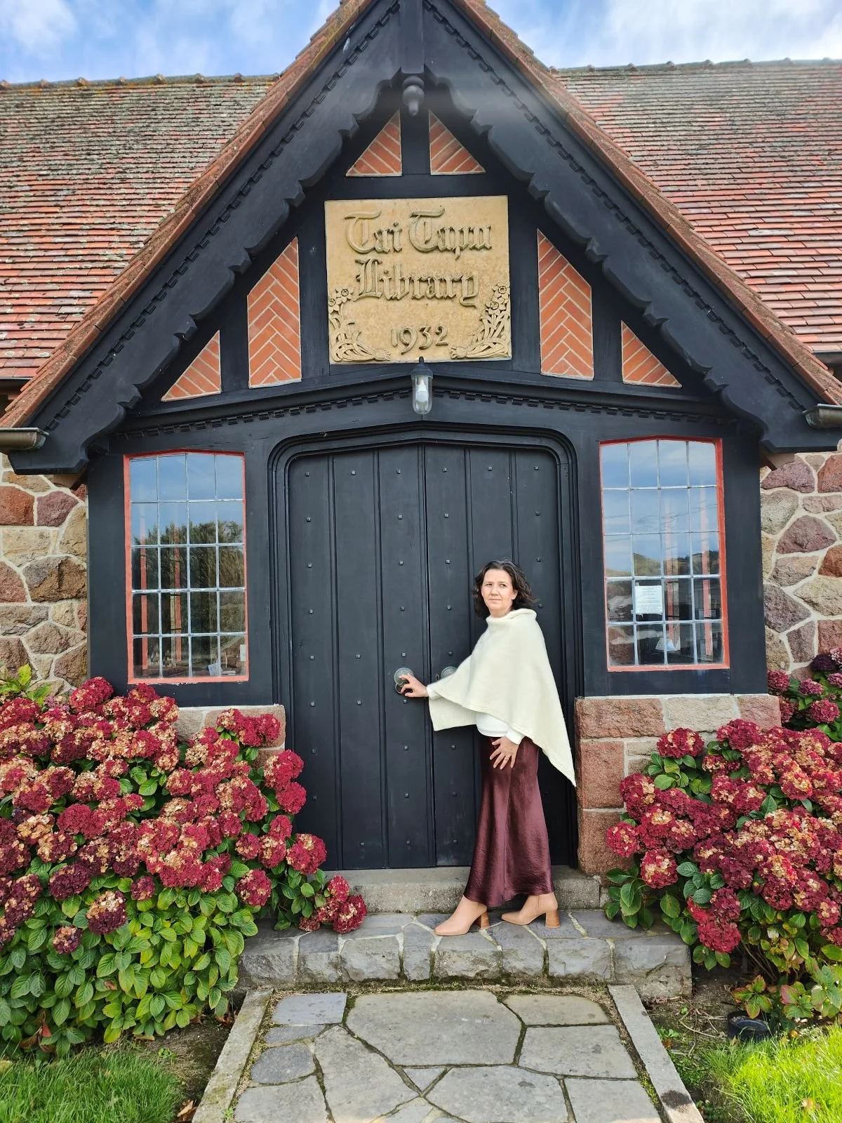 Angela wearing poncho at library.jpg