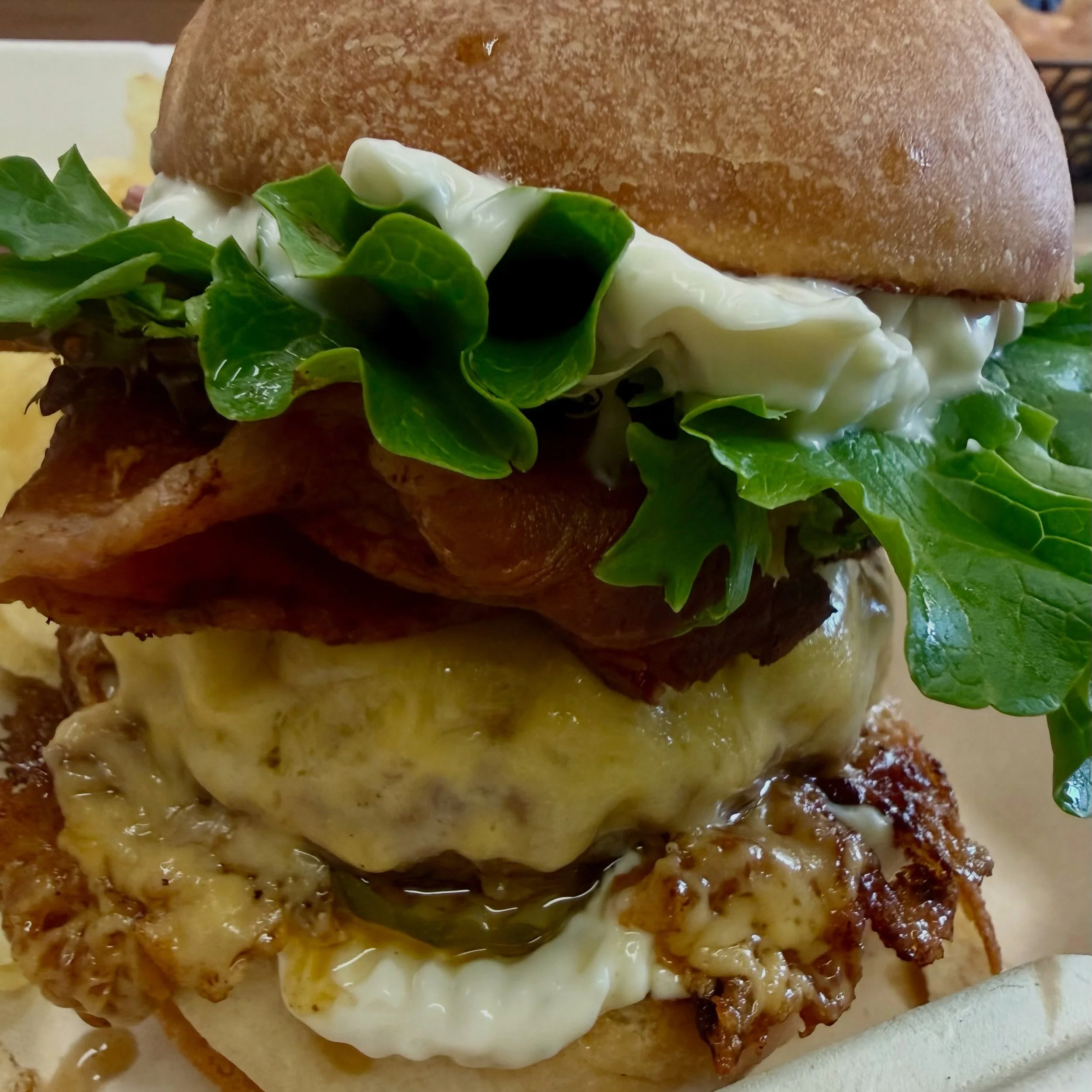 Sarah and her Hubs are about to enjoy Medford&rsquo;s Best Burger. #addbluecheesemayo #luncheonettecheeseburger #dontforgethtebacon #localorganicdelicious #downtownmedford