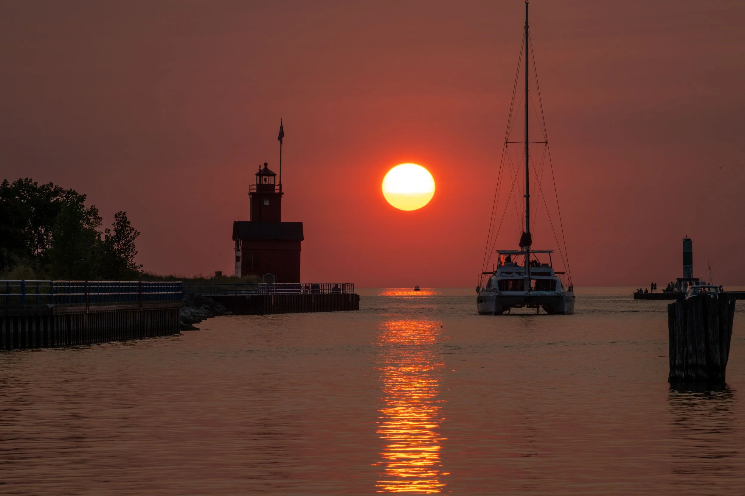 Holland Michigan Big Red Lighthouse Sunset with Sailboat