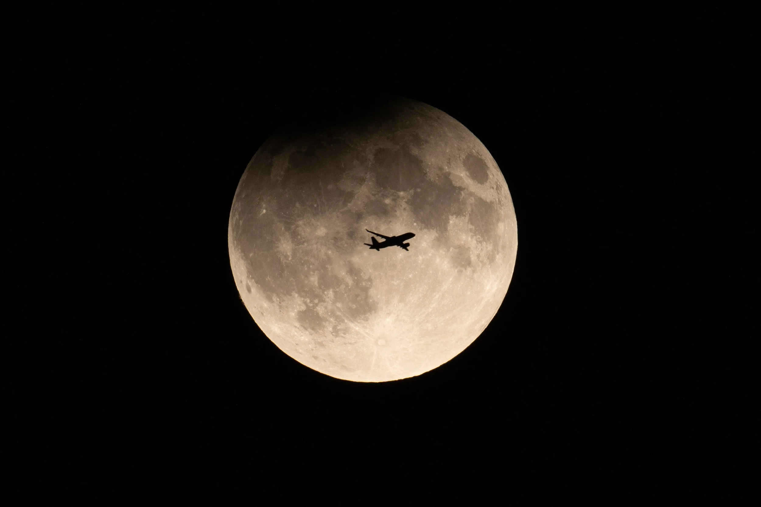 Airplane flyby of partial lunar eclipse, 2024