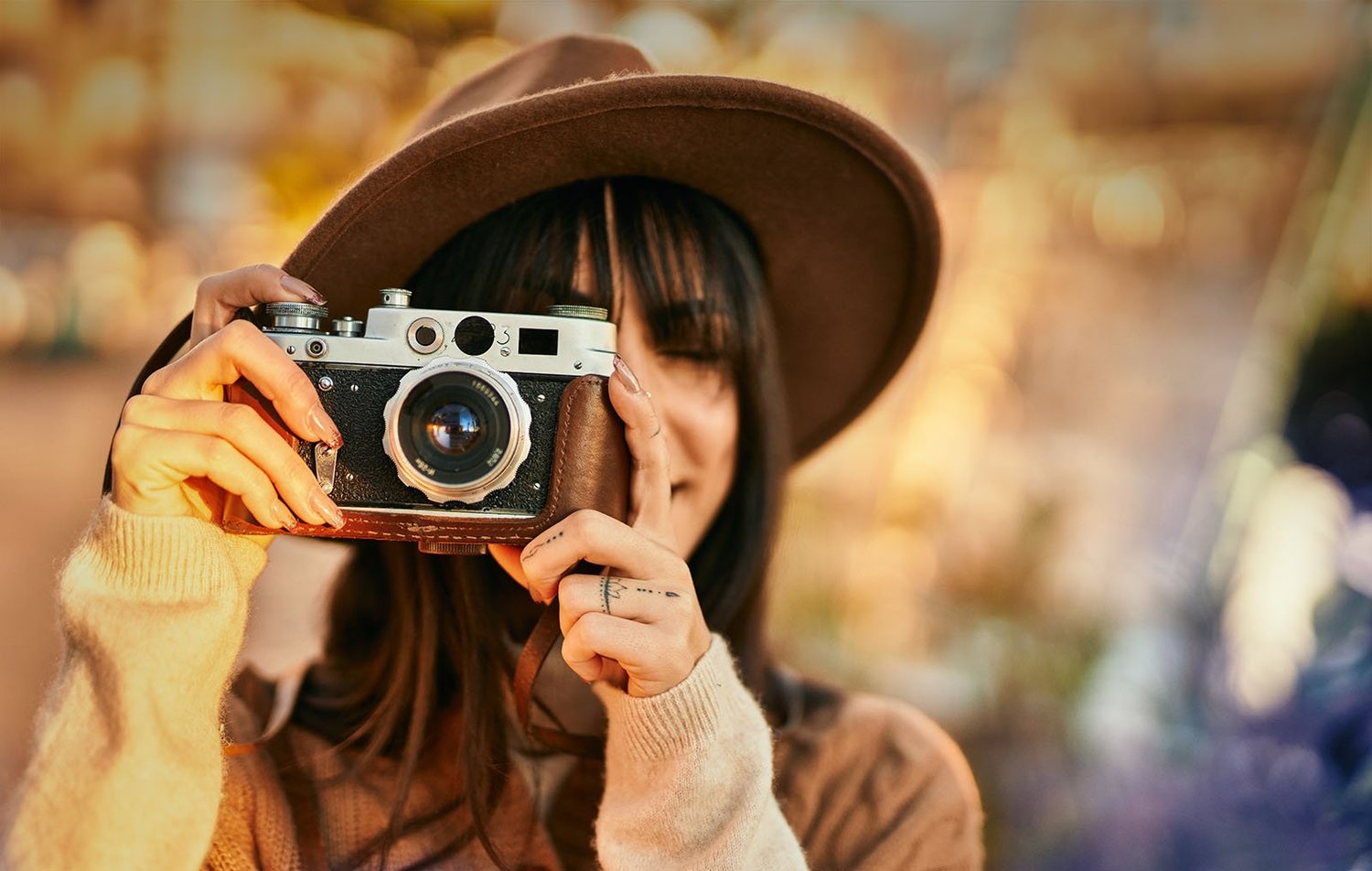 Photographer loading a roll of film