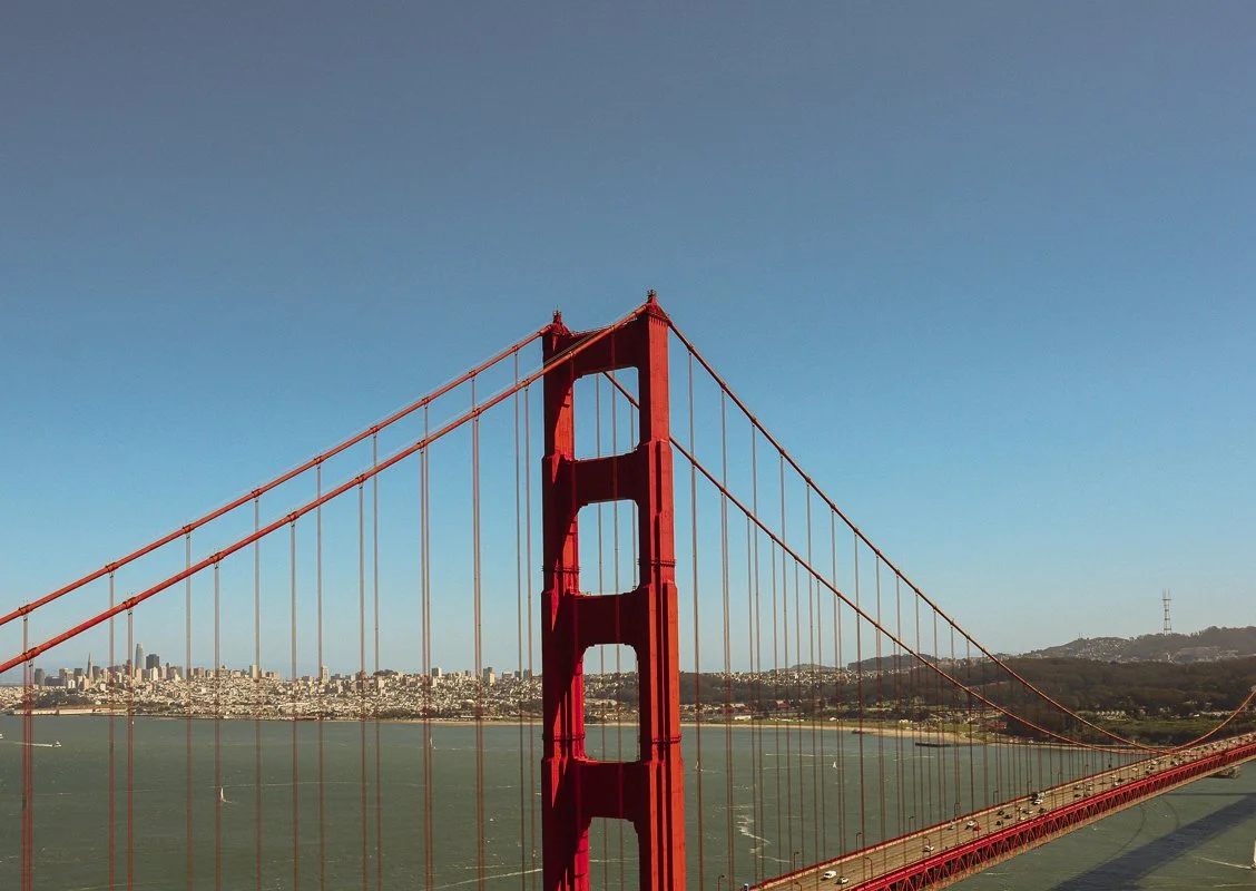 Golden Gate Bridge in San Francisco with city skyline in the background.