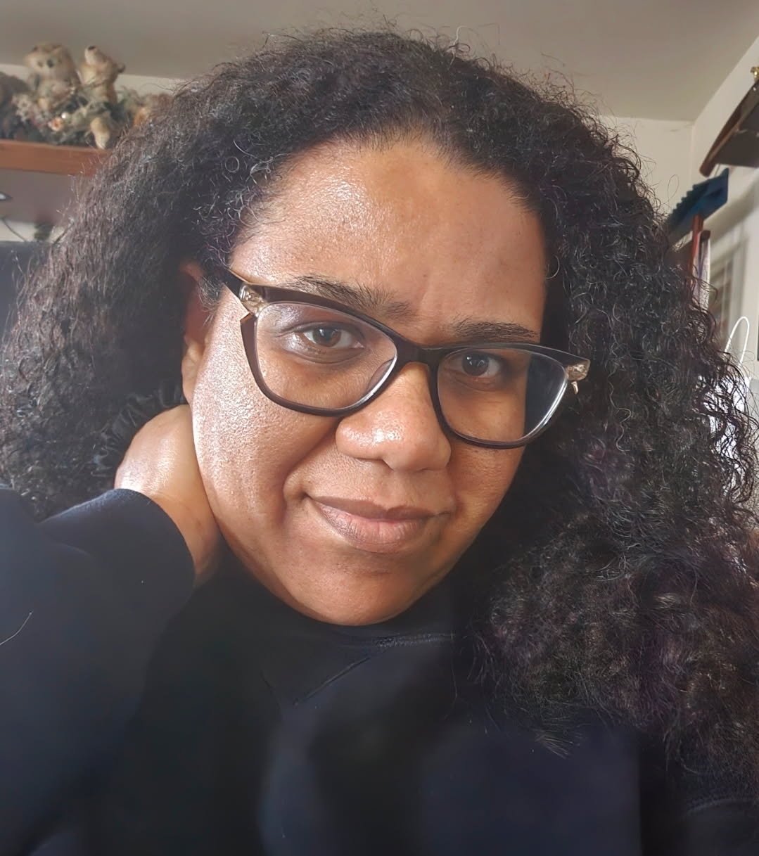 Portrait photo of Aisha the Business Witch