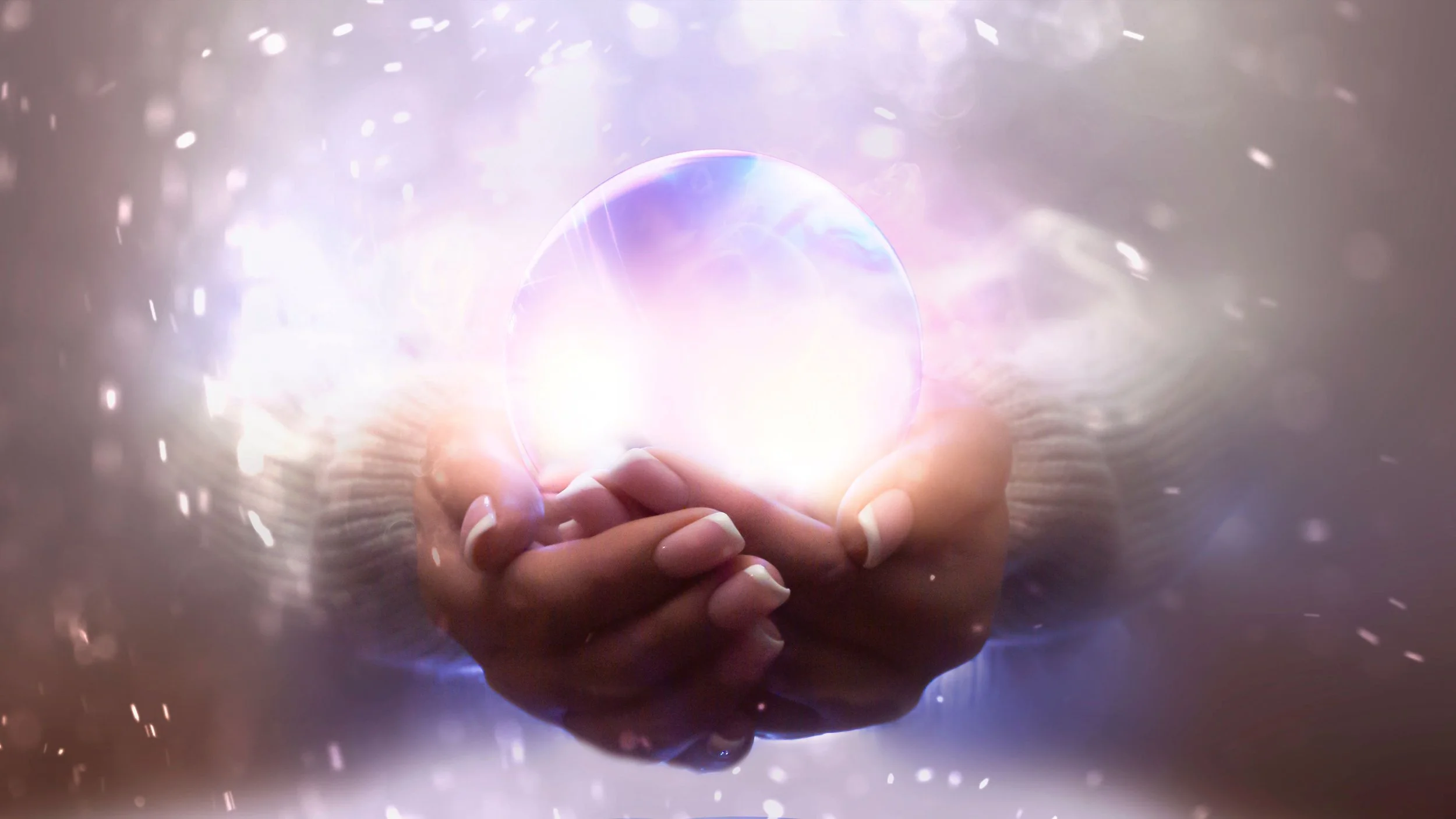 Woman holds orb of pale magic