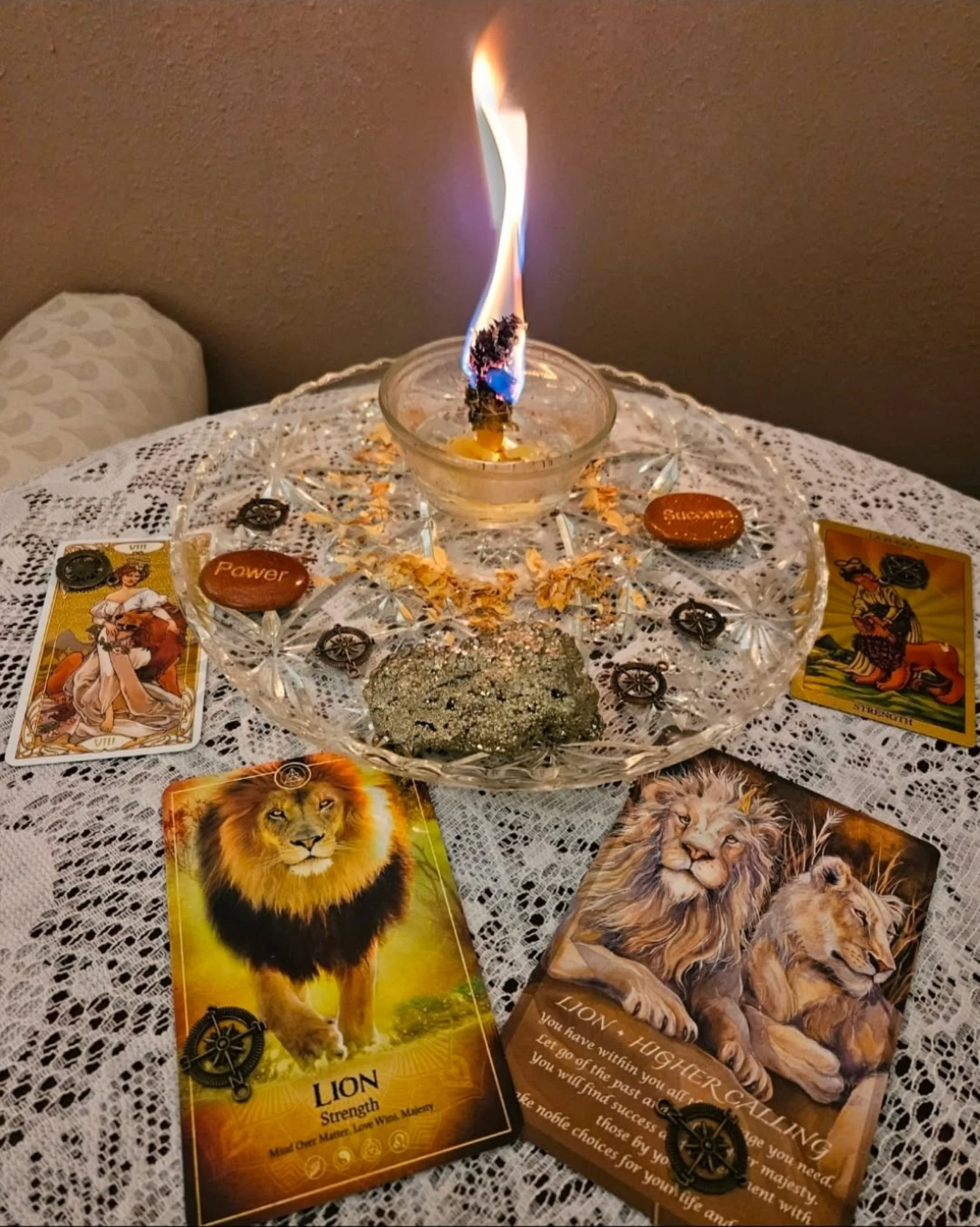 An altar for lion courage with tarot and oracle cards