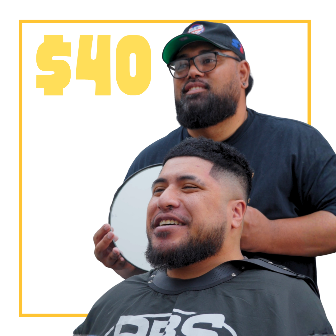 Barber giving a haircut to a male client inside a barber shop, with text saying $40 fade cut