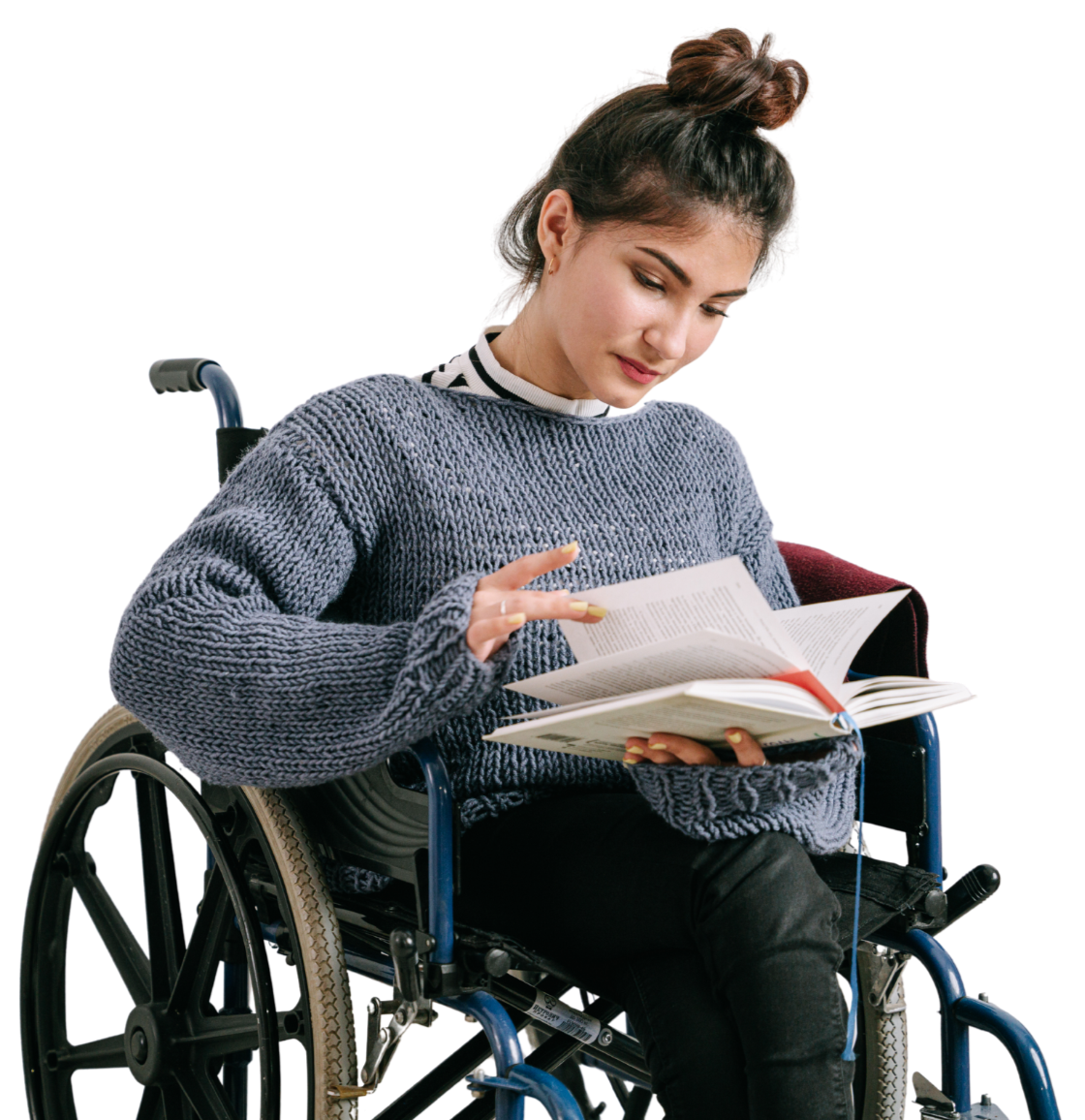 Young woman in a wheelchair reading a book