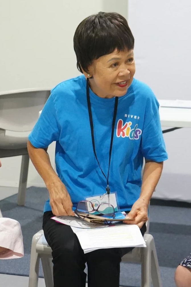 Our friendly river kids leader, Adele teaching on a Sunday morning wearing the blue river kids t-shirt.