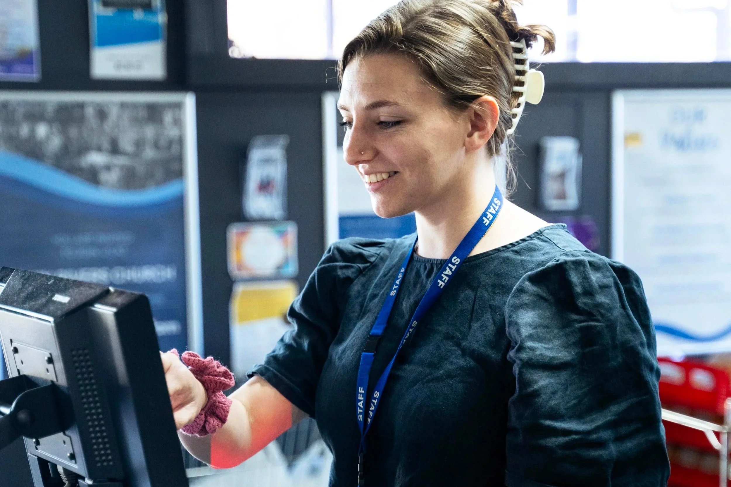 Cashier and friendly face Sophie, at the check-out at The Twin Rivers Food Outlet.