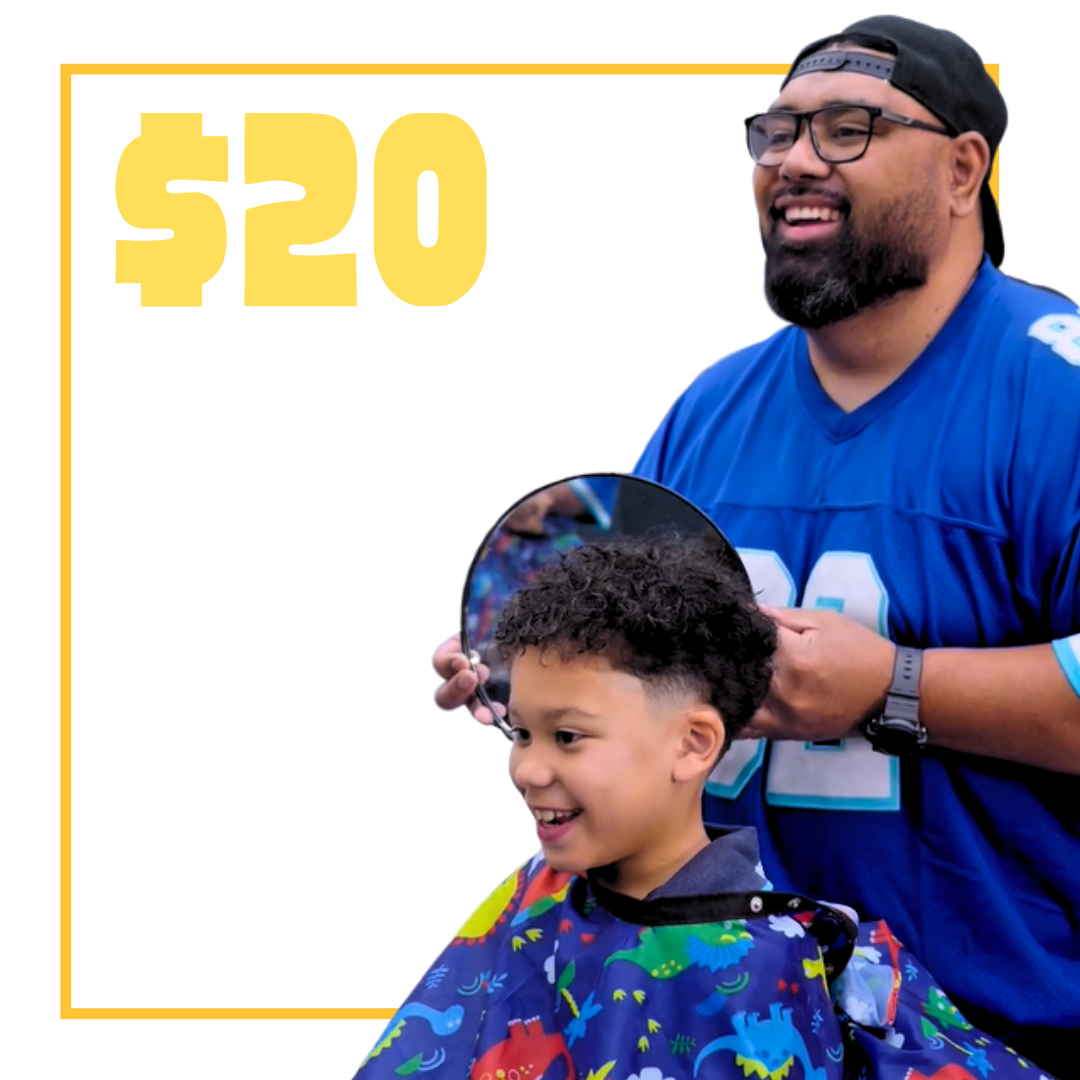 Barber giving a haircut to a young boy client inside a barber shop, with text saying $20 kids cut