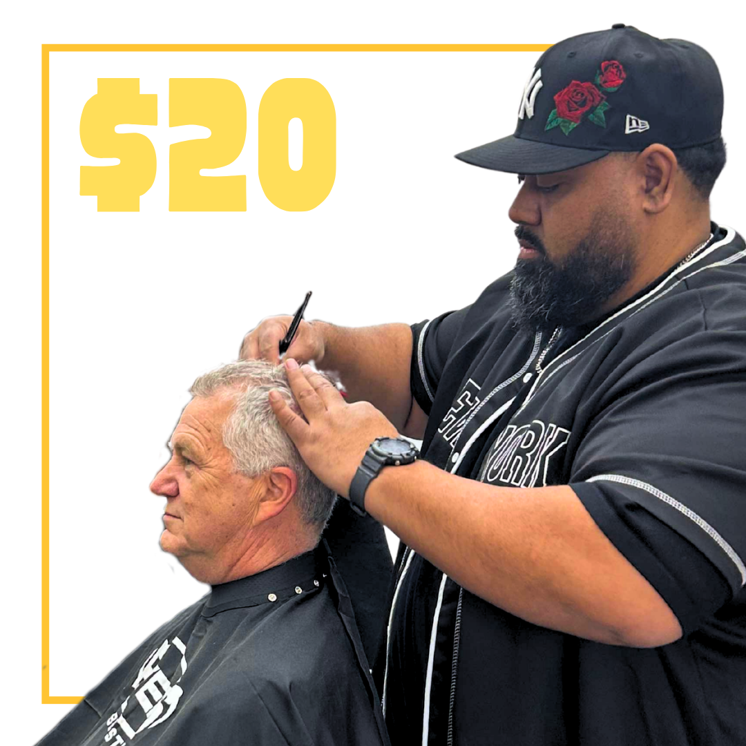 Barber giving a haircut to a senior male client inside a barber shop, with text saying $20 seniors cut