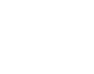Close-up of white quotation marks on a black background.