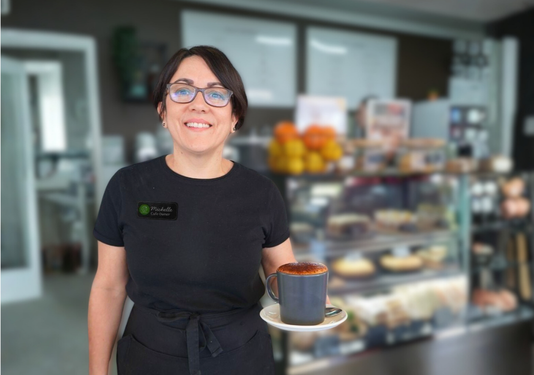 Cafe owner Michelle, serving a large hot chocolate at the Rivers Cafe.