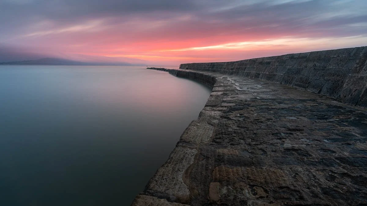 Sunrise in Lyme Regis Dorset, Long exposire, pink pastel skies