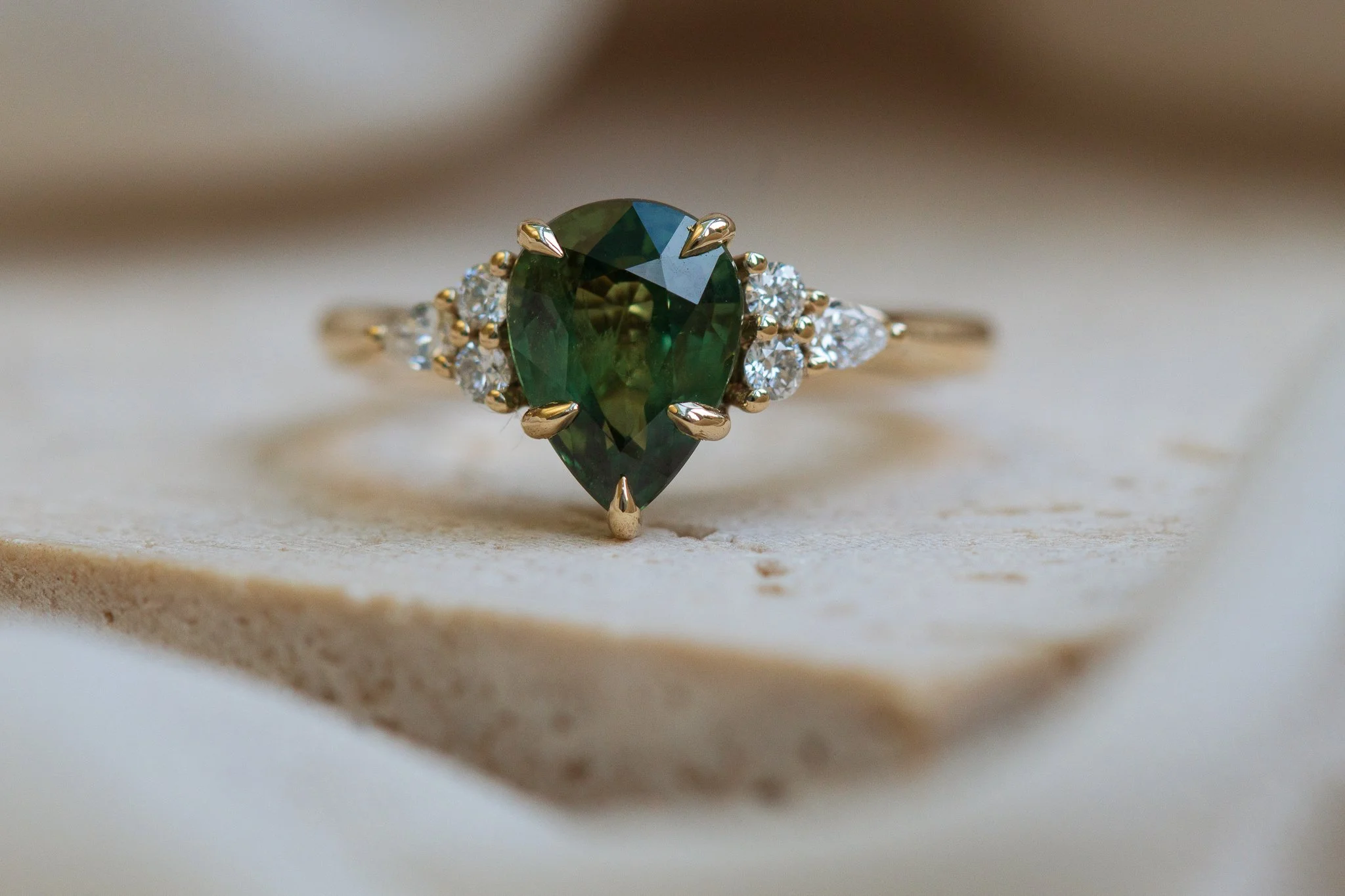 Heulwen-Lewis-Bespoke-Pear-Green-Sapphire-Trefoil-Floral-Inspired-Engagement-Ring