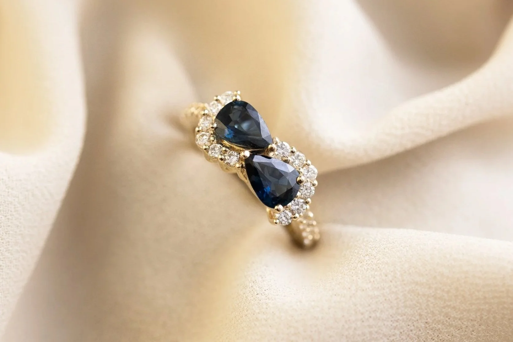 Heulwen-Lewis-Bespoke-Sapphire-Infinity-Diamond-Cluster-Ring-Remodel