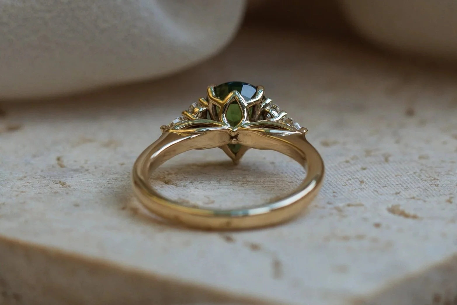 Heulwen-Lewis-Bespoke-Pear-Green-Sapphire-Trefoil-Floral-Inspired-Engagement-Ring