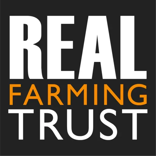 Text graphic with the words 'REAL FARMING TRUST' in bold white and orange letters on a black background.