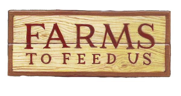Wooden sign reading 'FARMS TO FEED US'.
