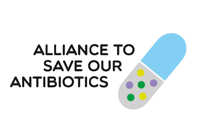 Graphic with the text 'Alliance to Save Our Antibiotics' and an illustration of a capsule pill with colorful dots.