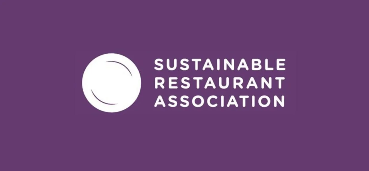 Logo of the Sustainable Restaurant Association on a purple background, featuring a white circle with curved lines.
