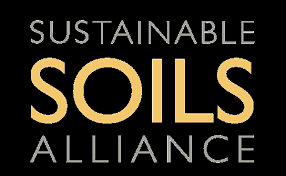 Sustainable Soils Alliance logo with black background and gold and white text.