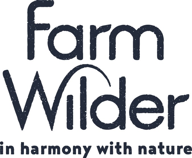 The logo for 'Farm Wider' with the tagline 'in harmony with nature,' featuring stylized text.