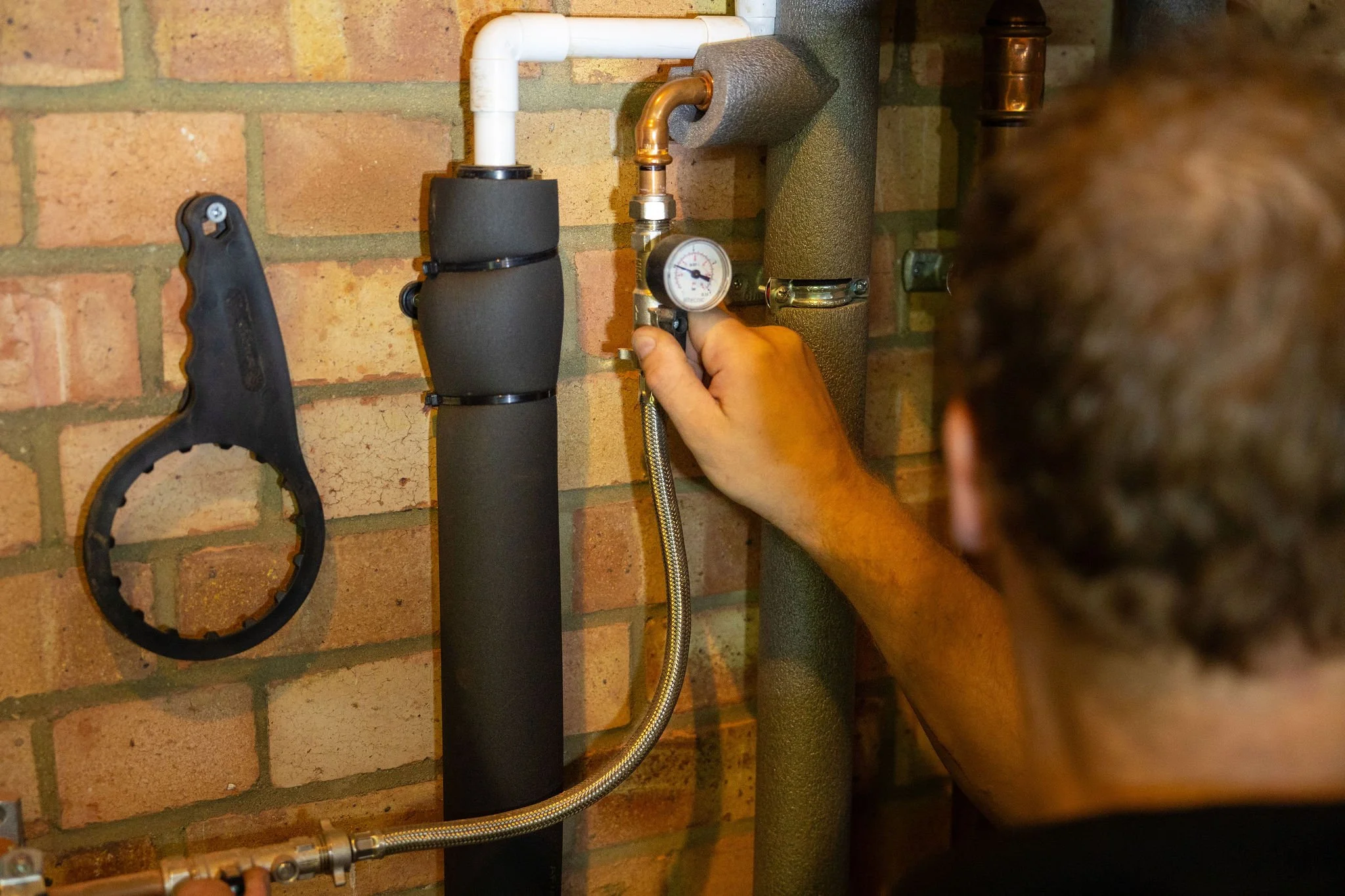 Gas Engineer checking boiler compliance