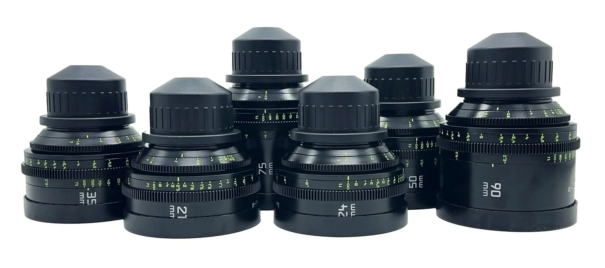 A collection of seven black camera lenses with focus and zoom rings, arranged in a row on a white background.